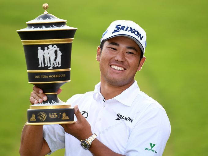 Smiling Hideki Matsuyama Holding Trophy