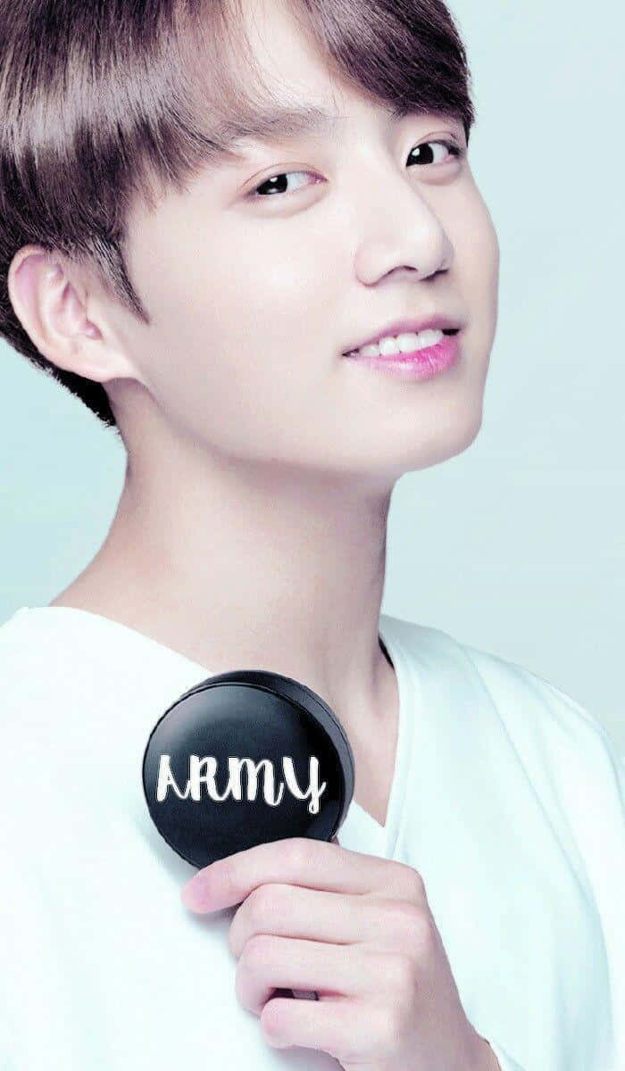 Smiling Man Holding A R M Y Badge Background