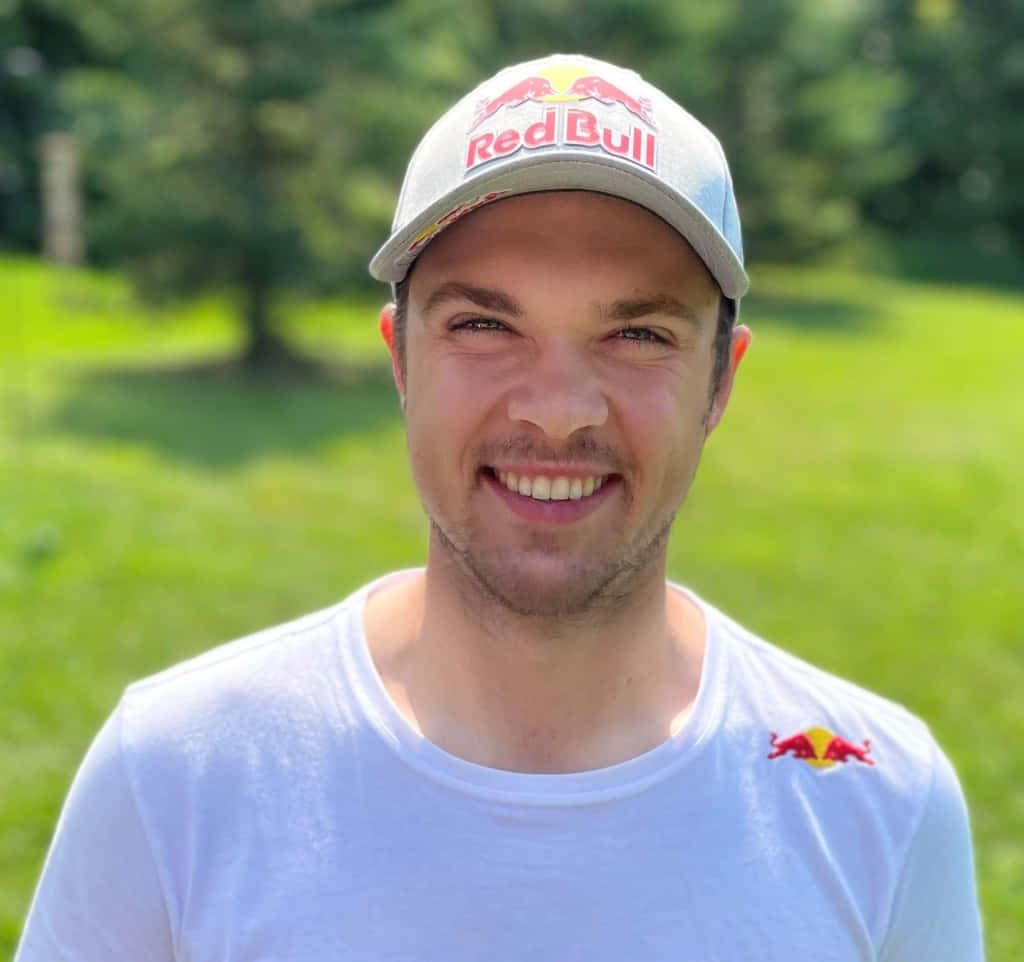 Smiling Man Red Bull Cap Outdoors