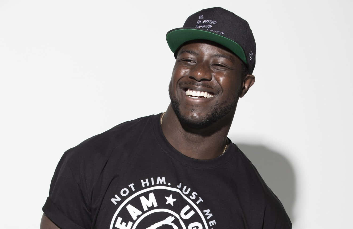 Smiling Manin Black T Shirtand Cap Background