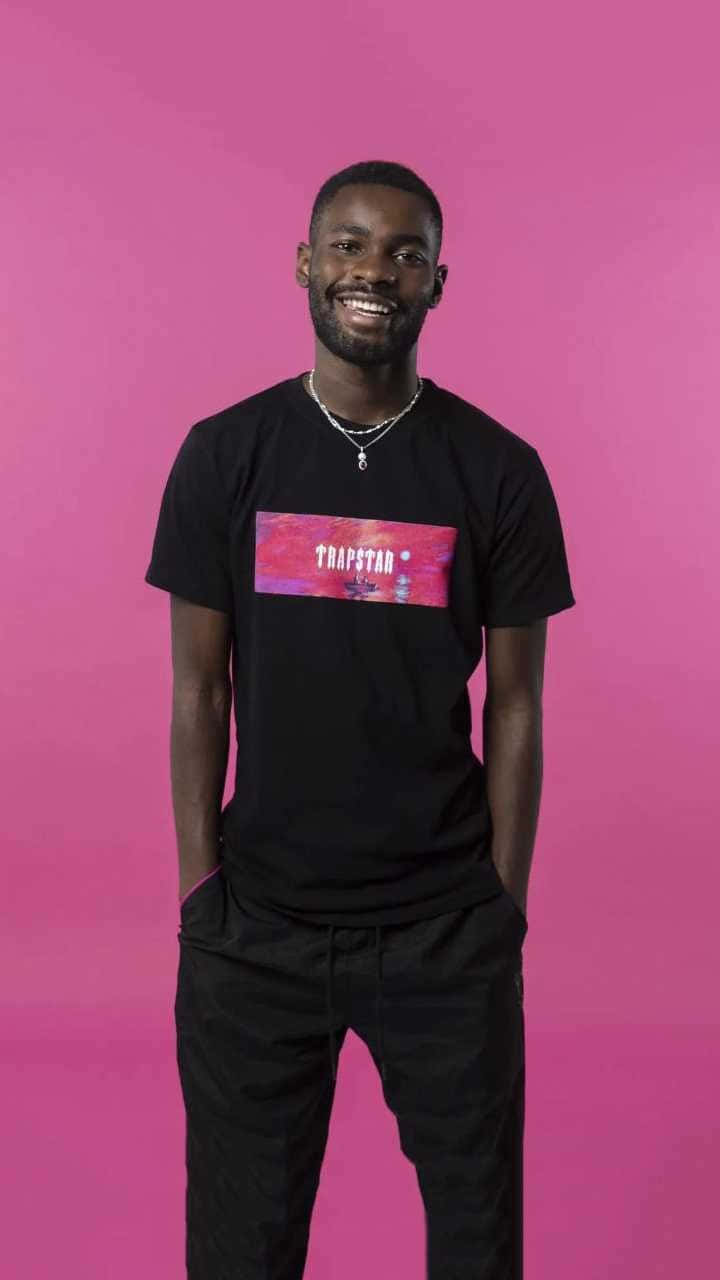 Smiling Manin Black Tshirt Pink Background Background