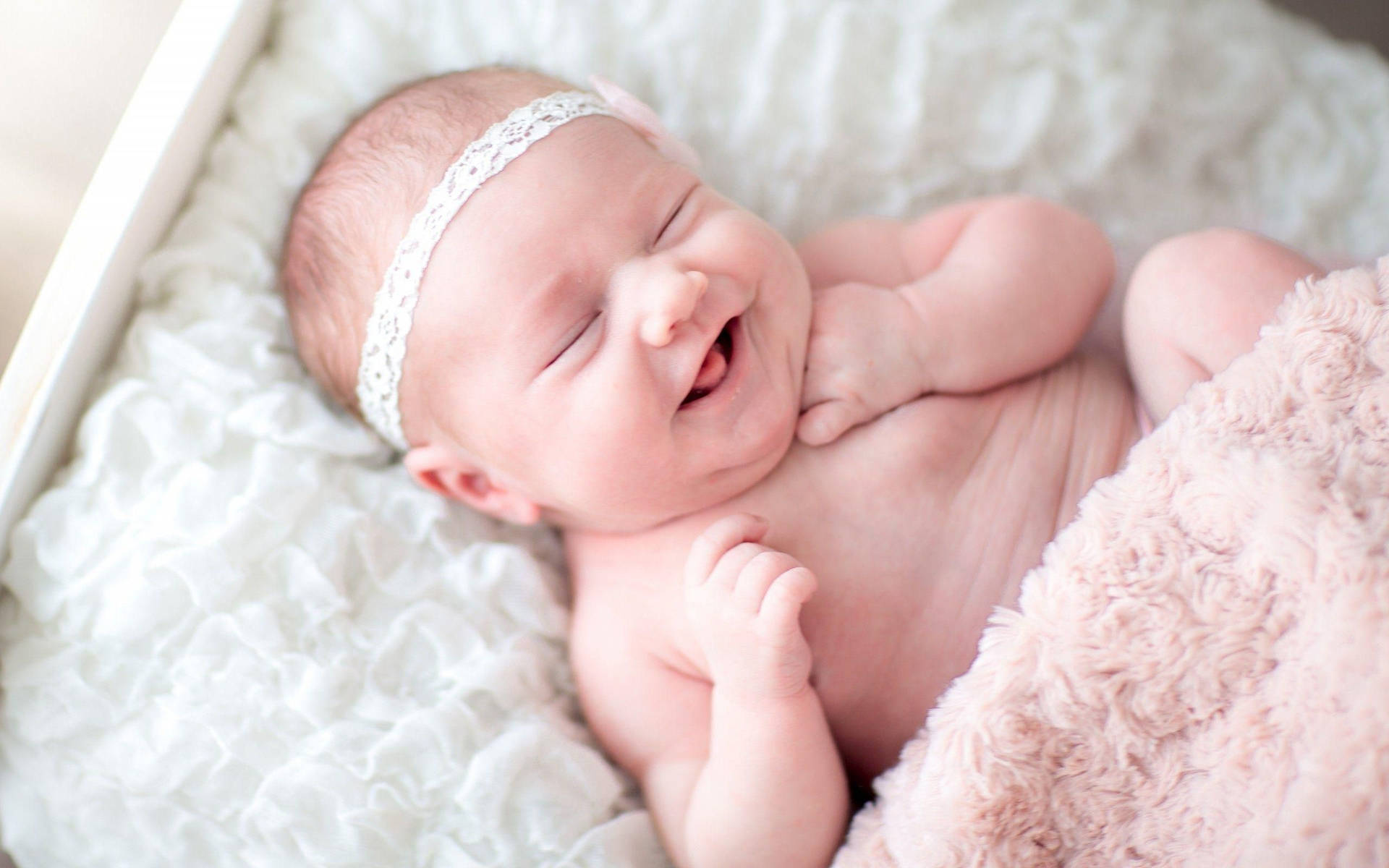 Smiling Newborn Baby