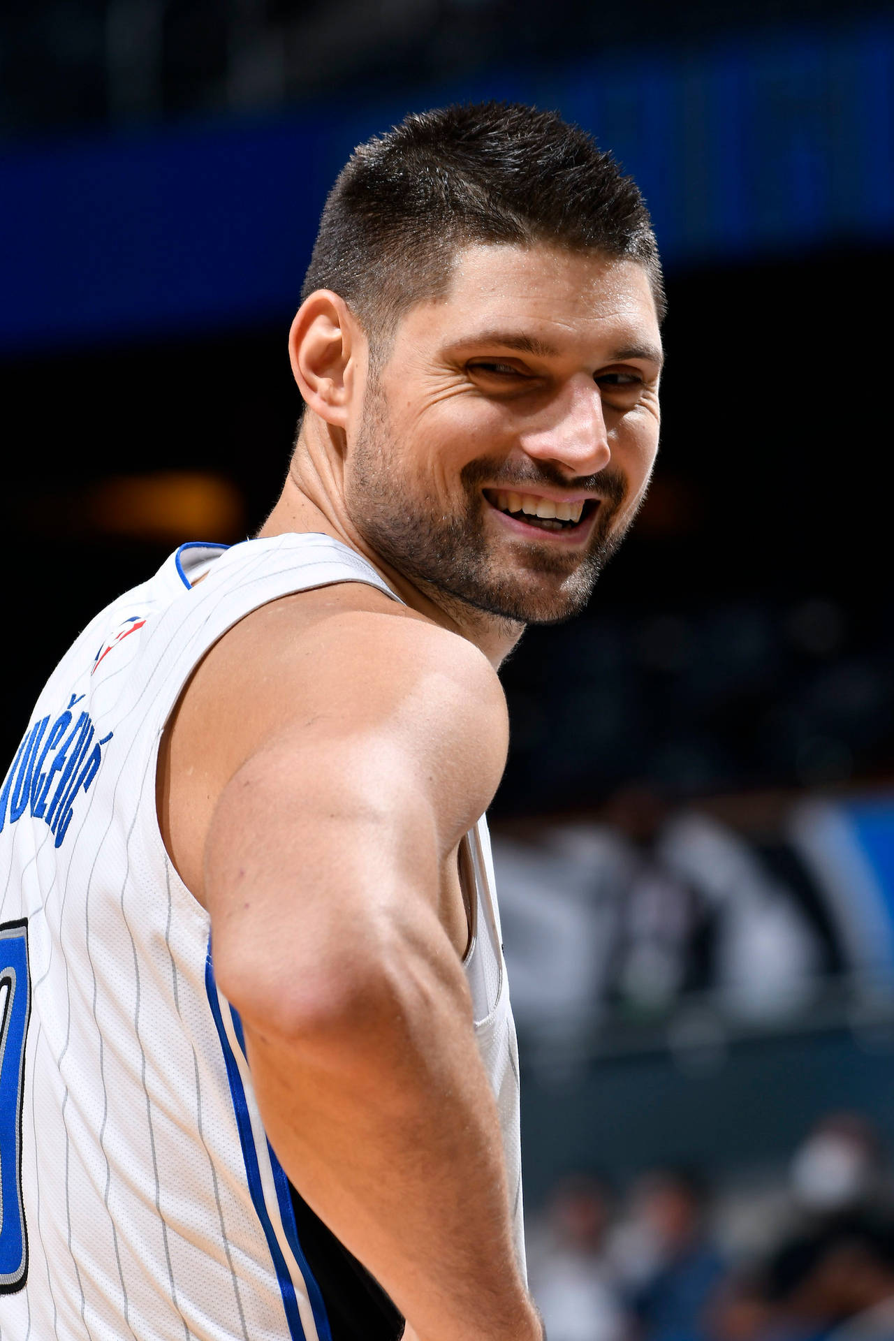 Smiling Nikola Vucevic Basketball Player Orlando Magic Background