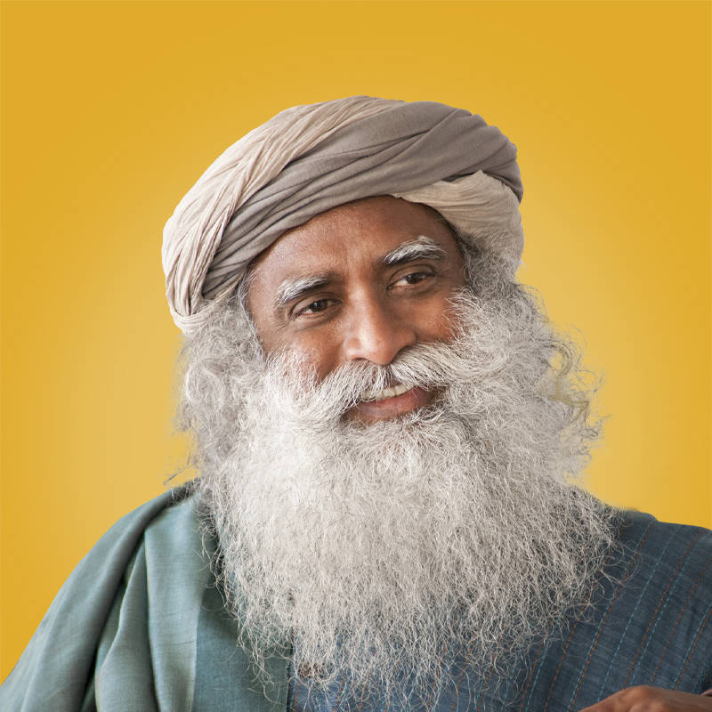 Smiling Sadhguru Against A Yellow Background Background