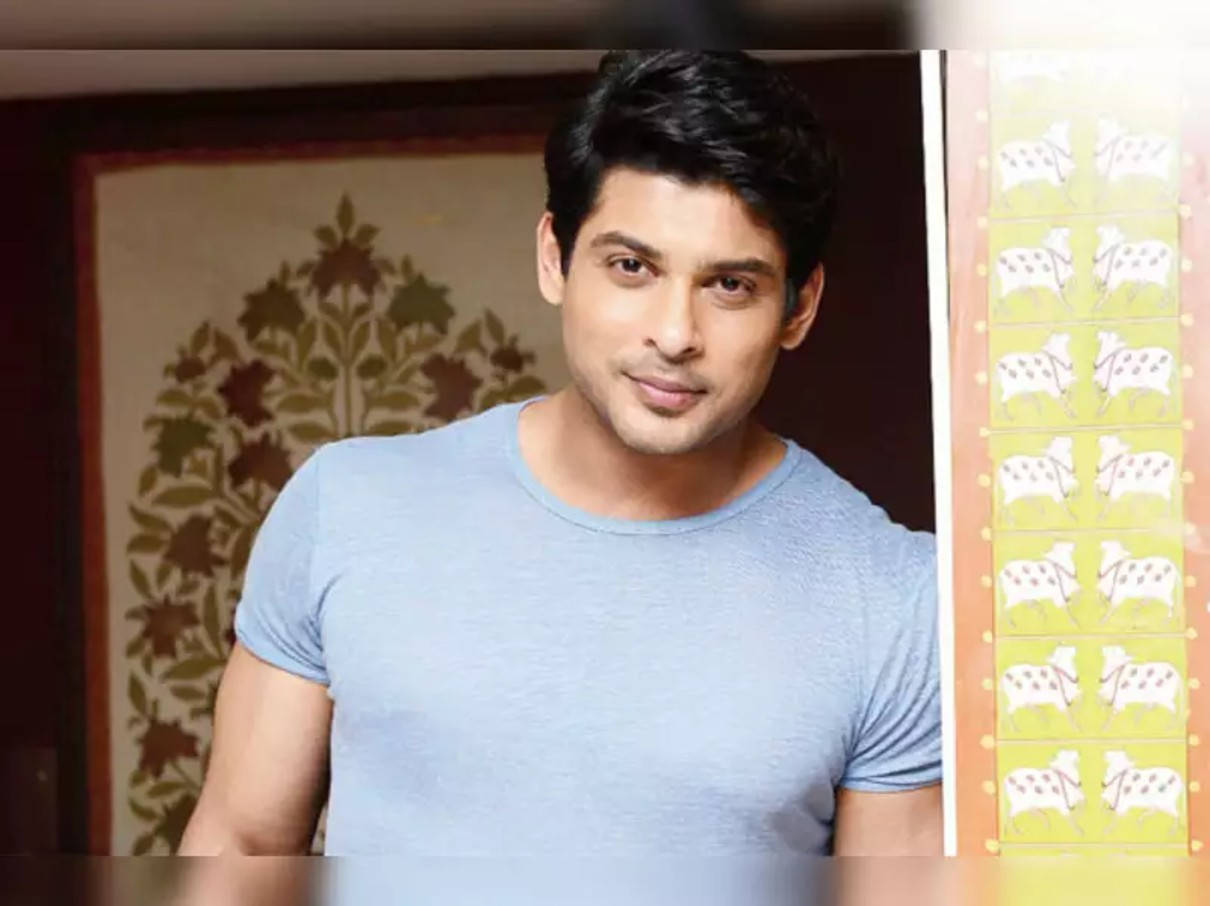 Smiling Sidharth Shukla In Blue Shirt Background