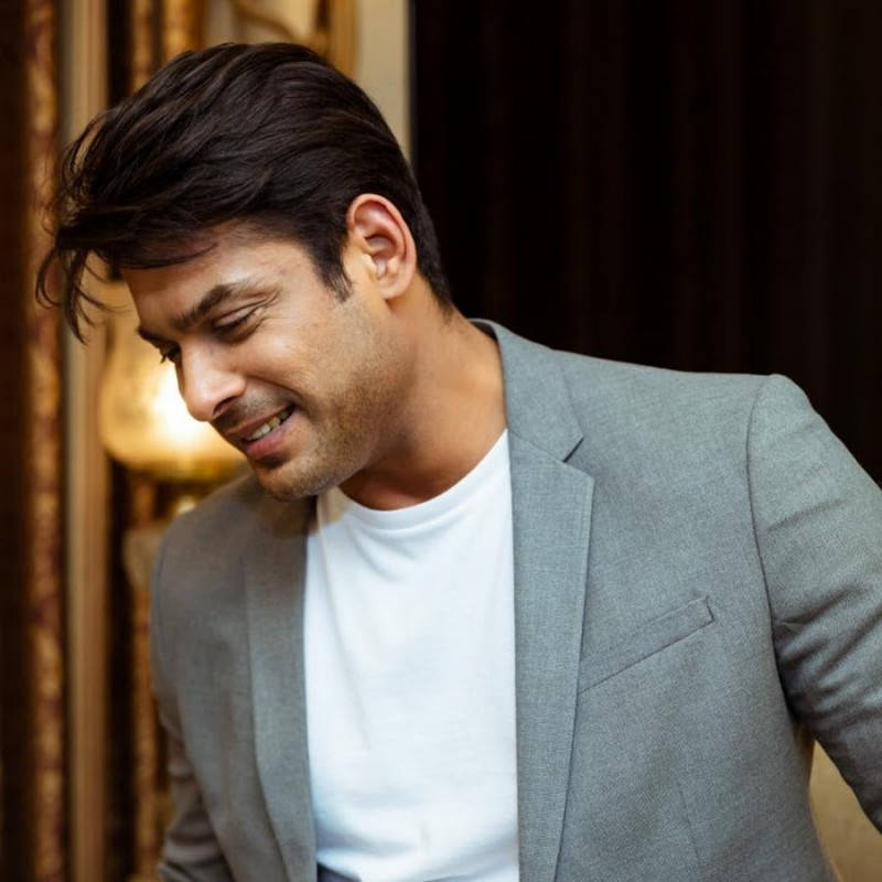 Smiling Sidharth Shukla In Gray Suit Background