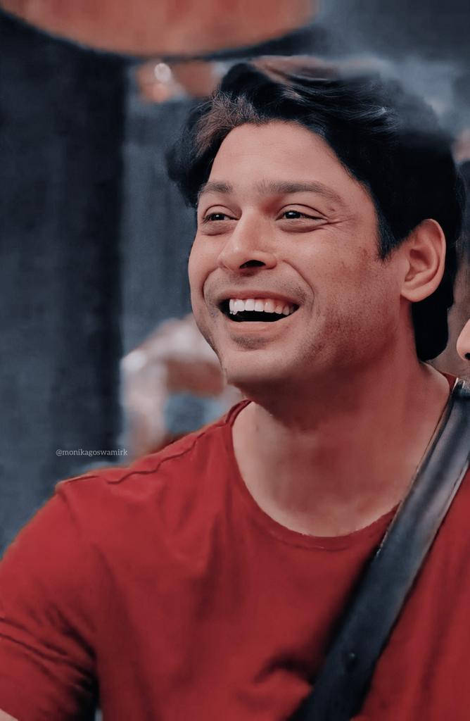 Smiling Sidharth Shukla In Red Shirt