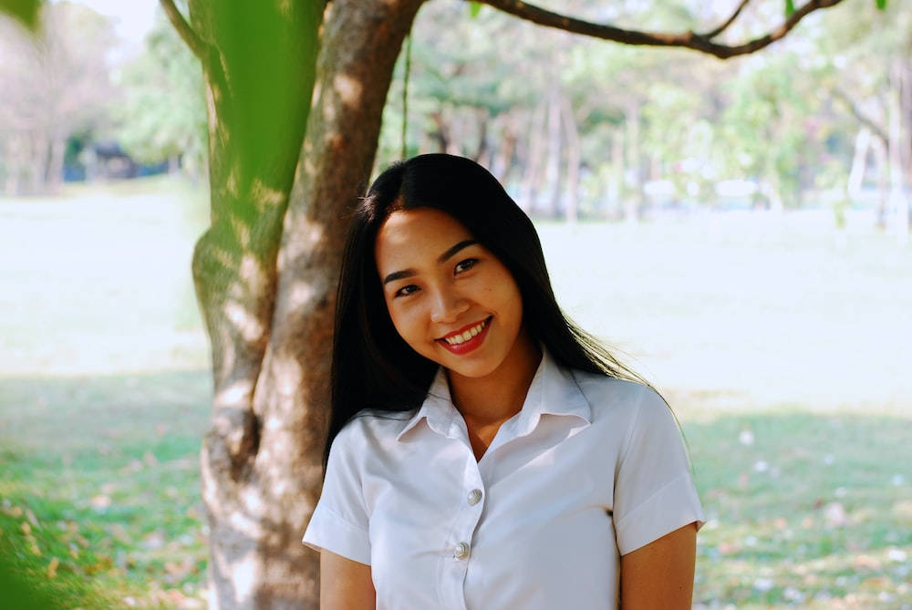 Smiling Thailand Woman In White Uniform Background