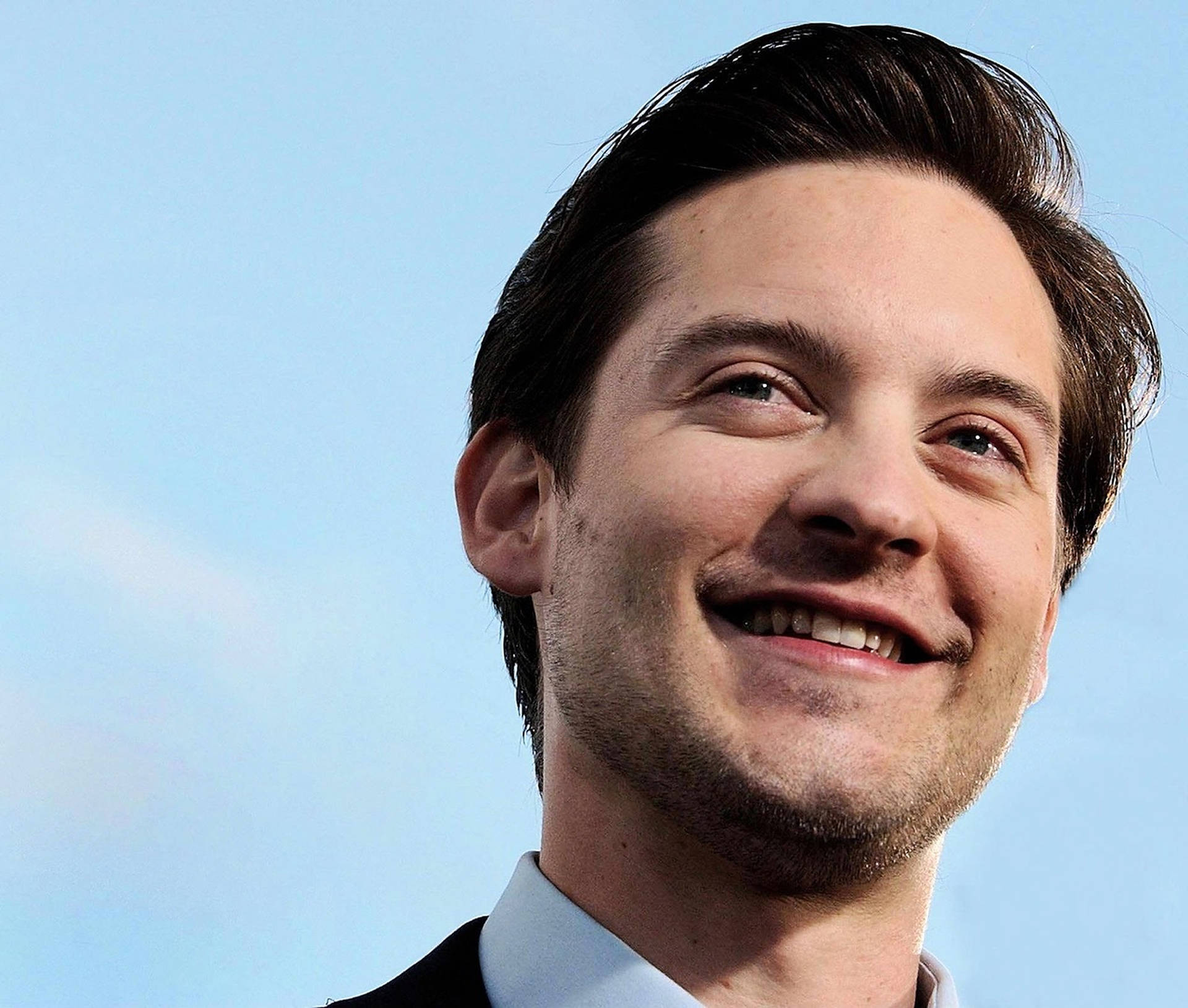 Smiling Tobey Maguire Background