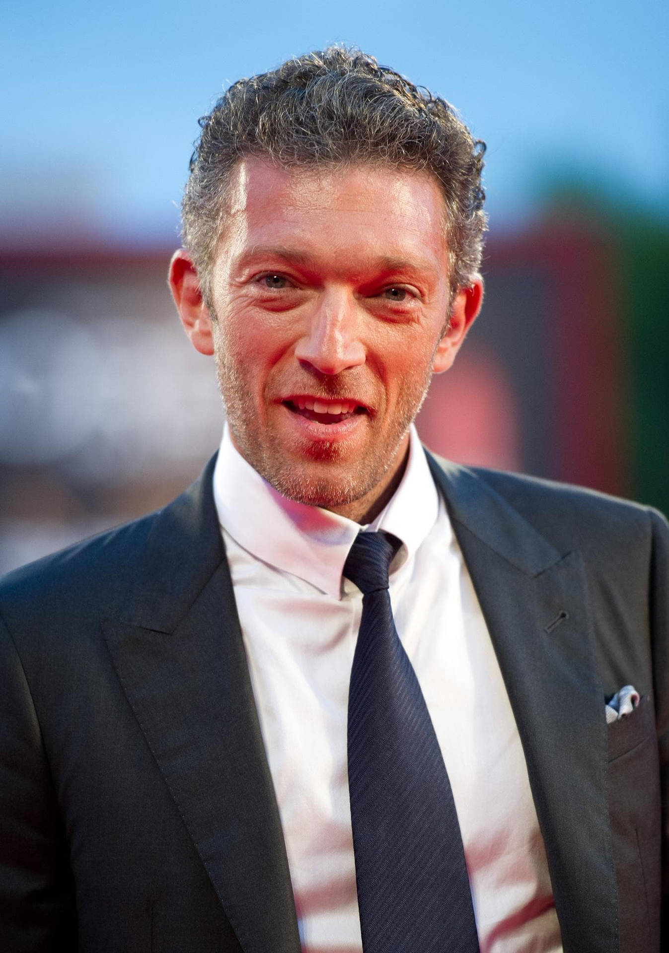 Smiling Vincent Cassel Selective Focus Background