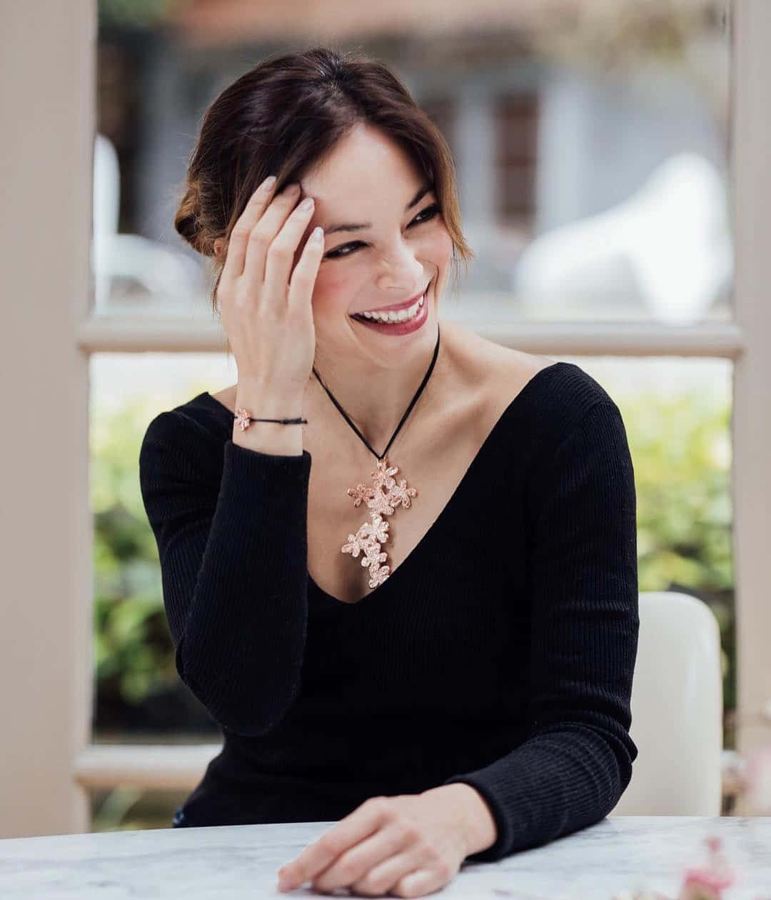 Smiling Woman Black Top Floral Necklace Background