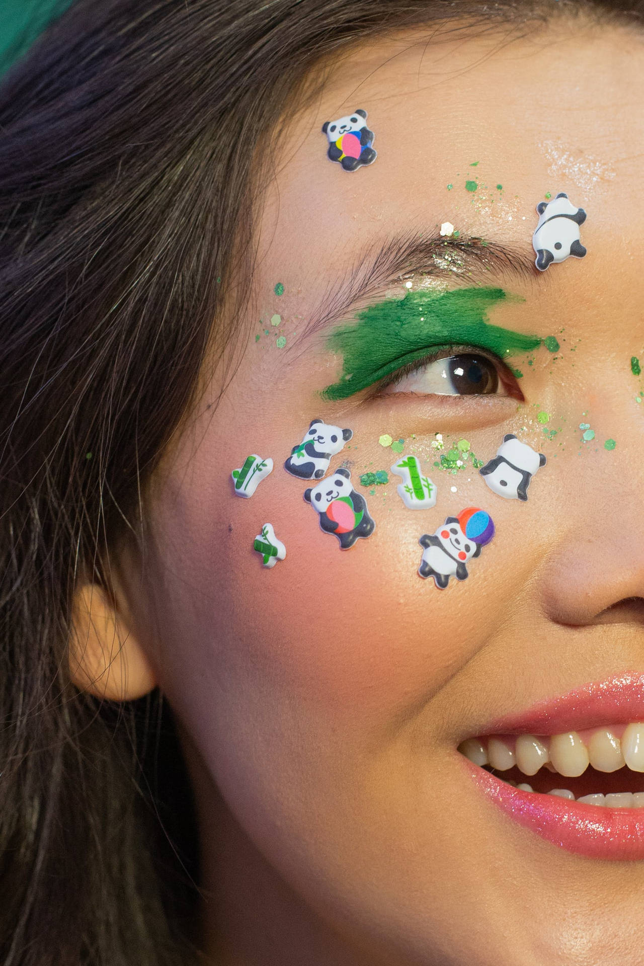 Smiling Woman With Beautiful Panda Makeup Background