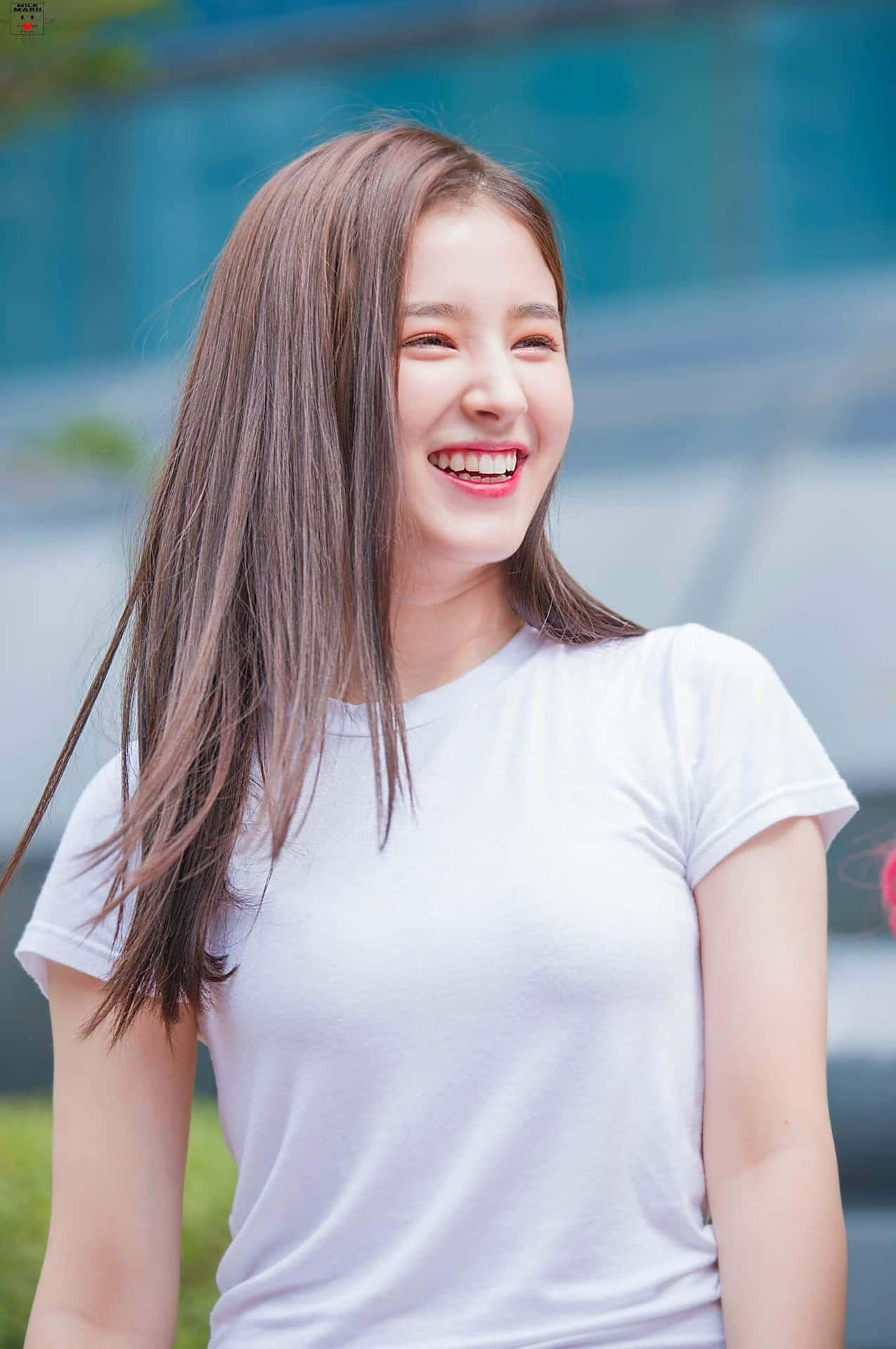 Smiling Womanin White Tee