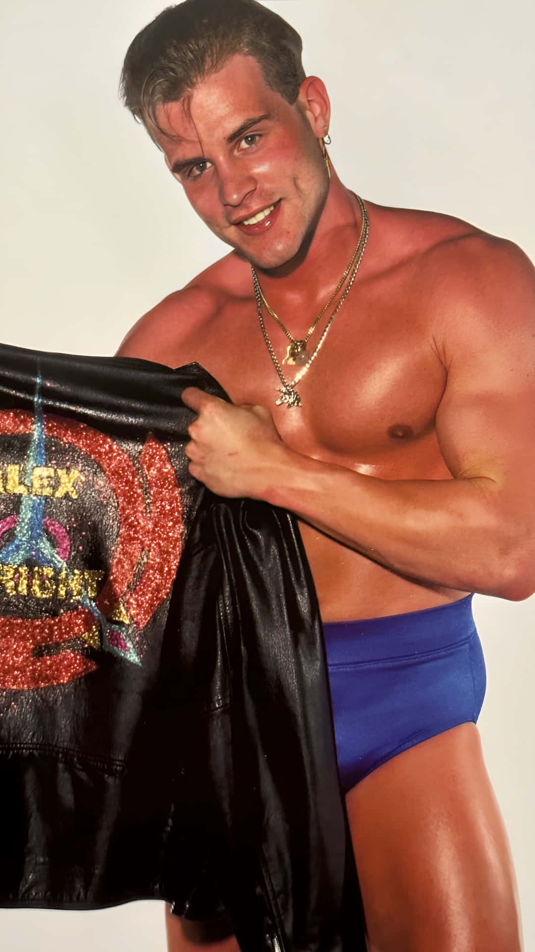 Smiling Wrestler Holding Jacket Background