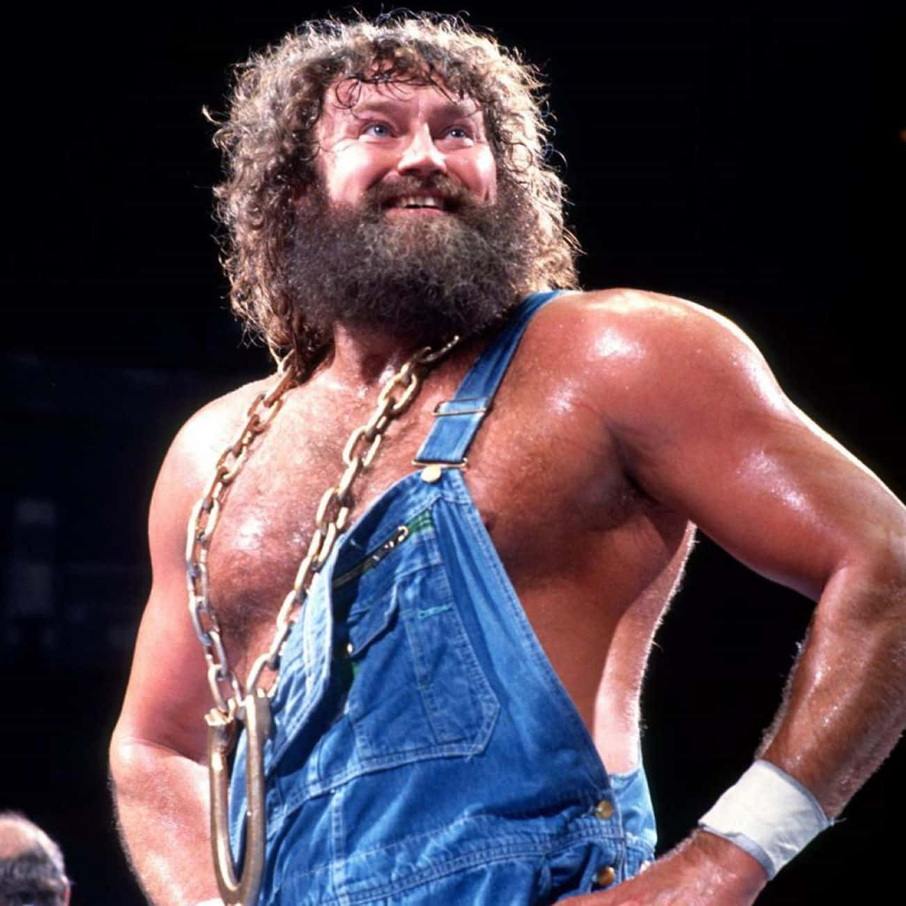 Smiling Wrestler With Chainand Overalls Background