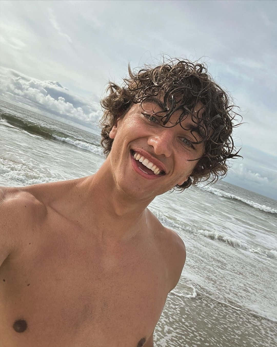 Smiling Young Man Beach Selfie