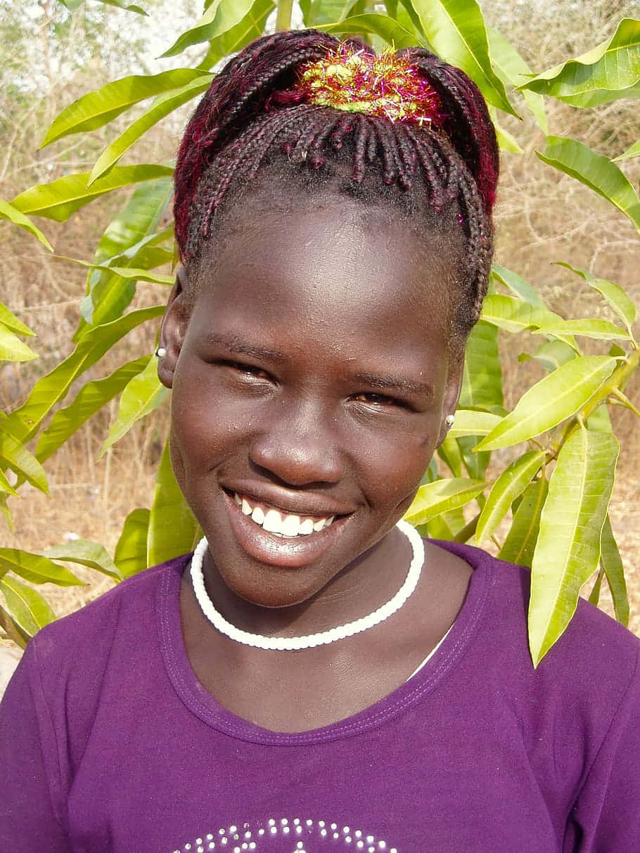 Smiling Young South African Woman With Natural Dark Skin Background