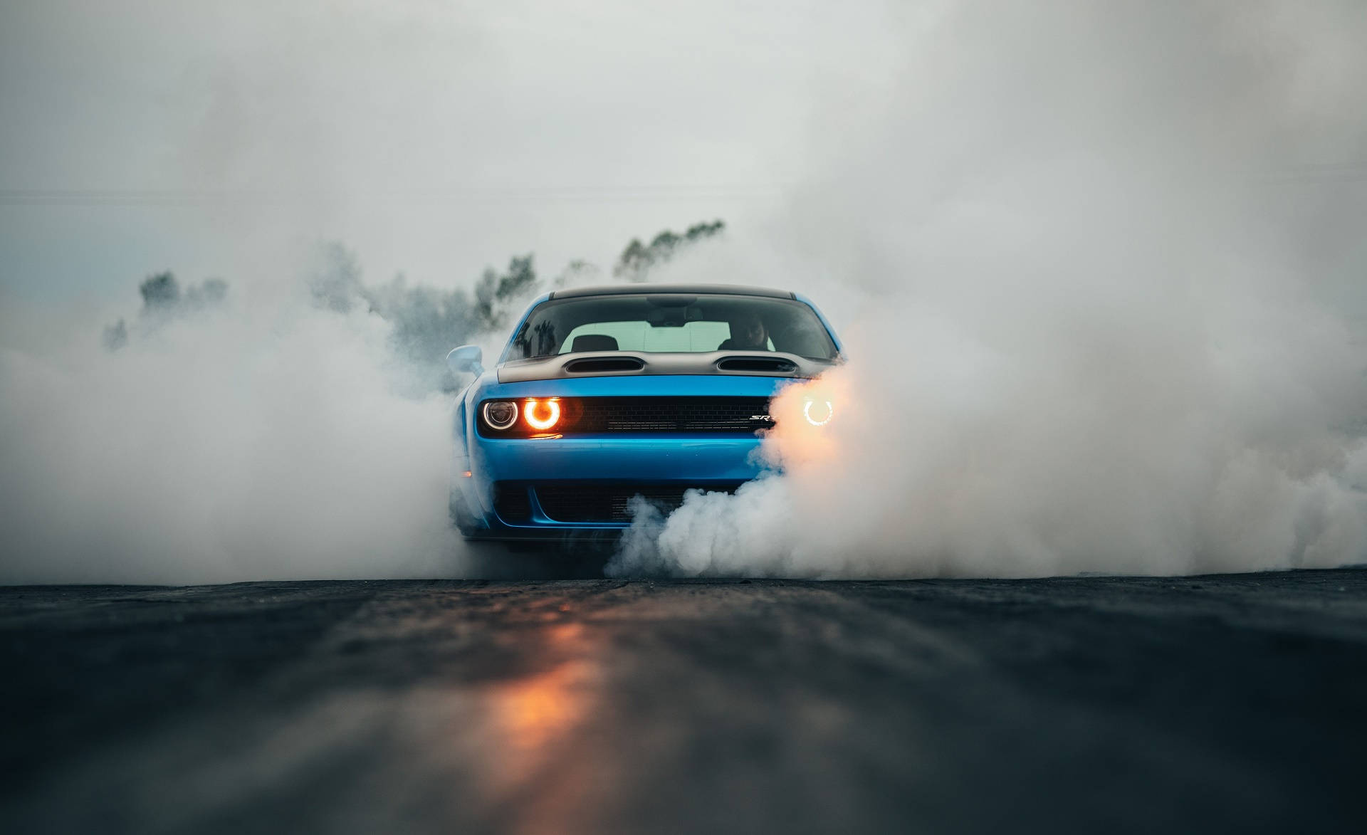 Smoke Surrounding A Blue Dodge Challenger