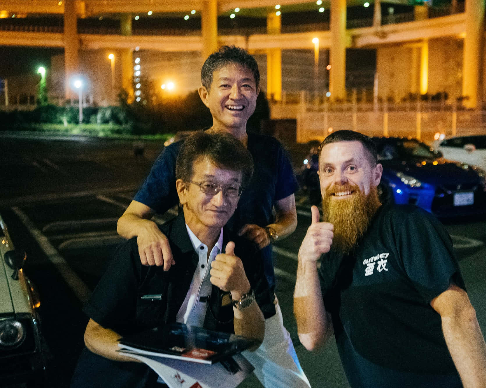 Smokey_ Nagata_with_ Friends_at_ Night Background