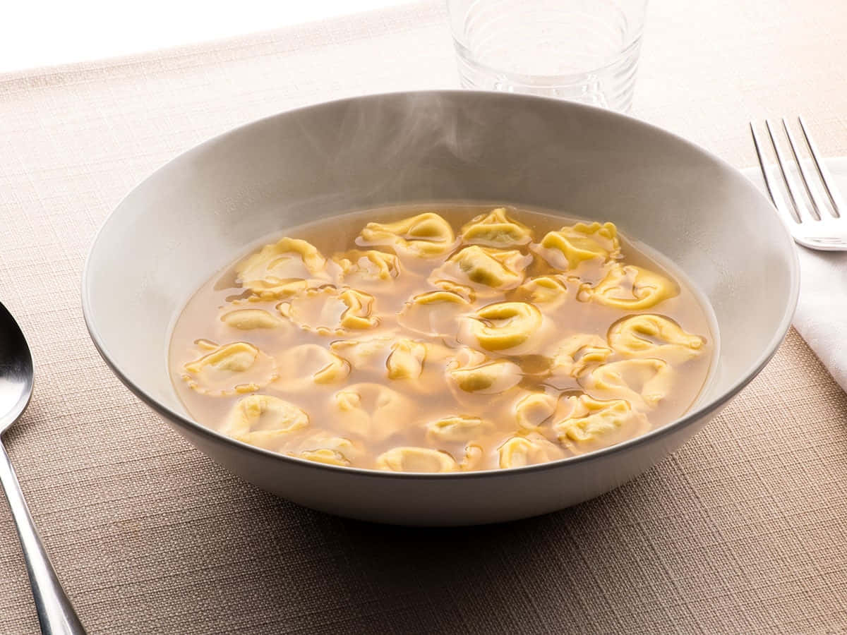 Smoking Hot Tortellini In Brodo Background