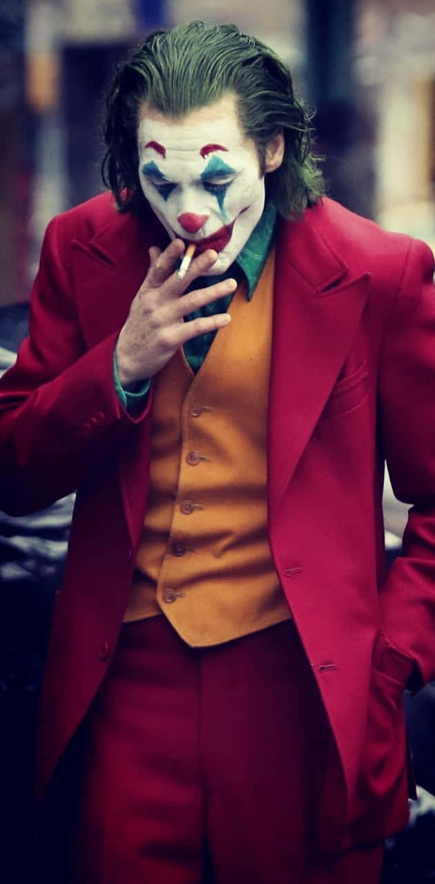 Smoking Joker Pfp In Red Suit Background
