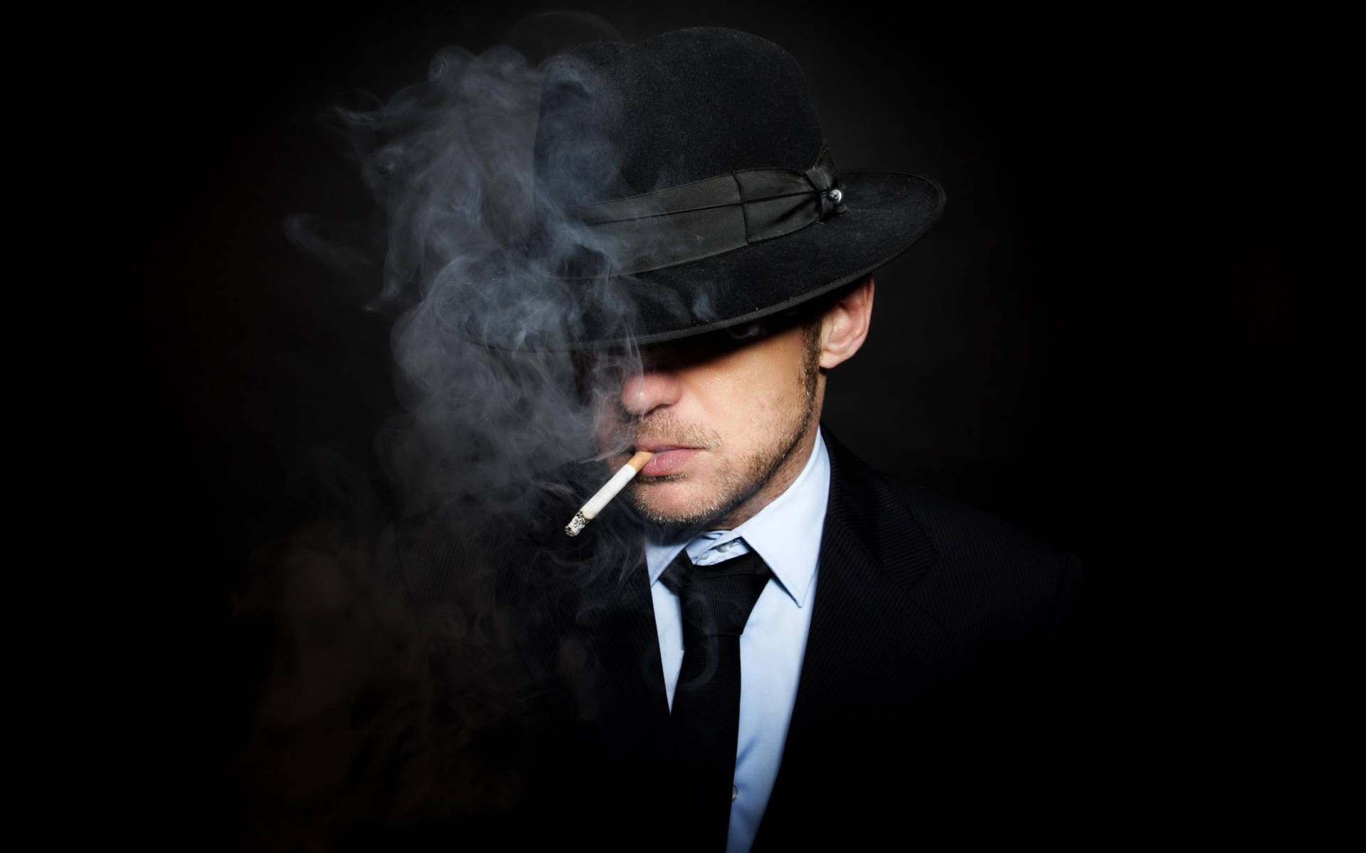 Smoking Mafia In Black Suit Background