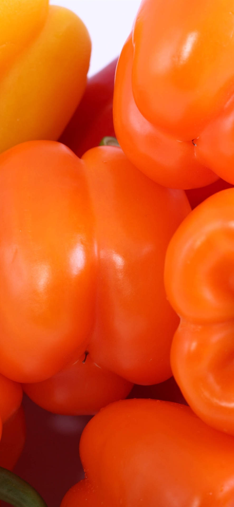 Smooth Orange Bell Peppers Background