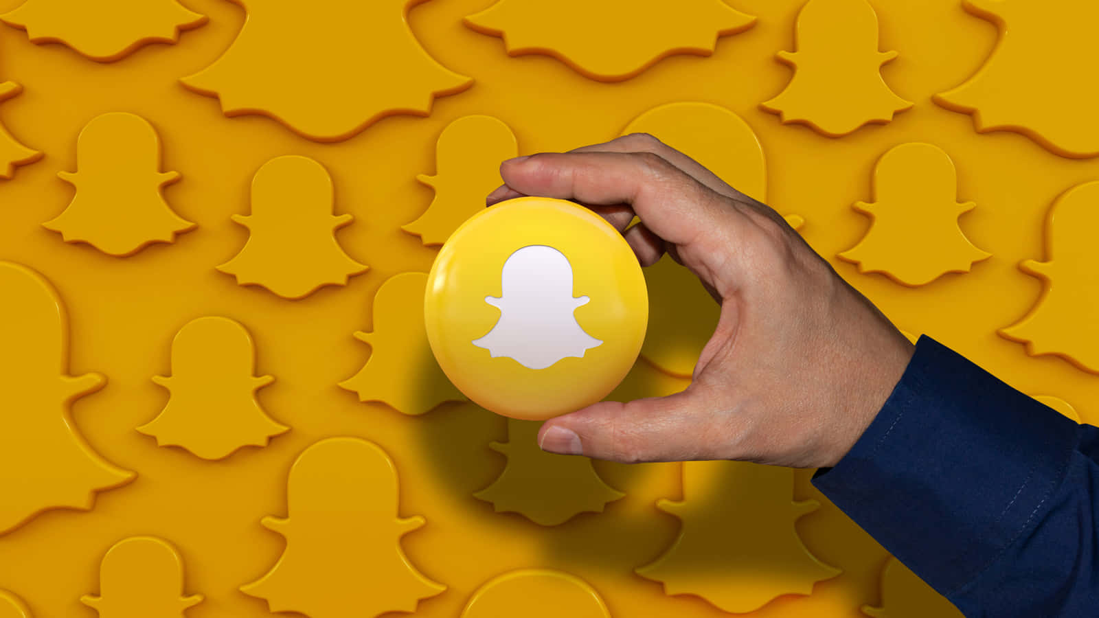Snapchat_ Logo_ Held_ Against_ Ghost_ Background Background