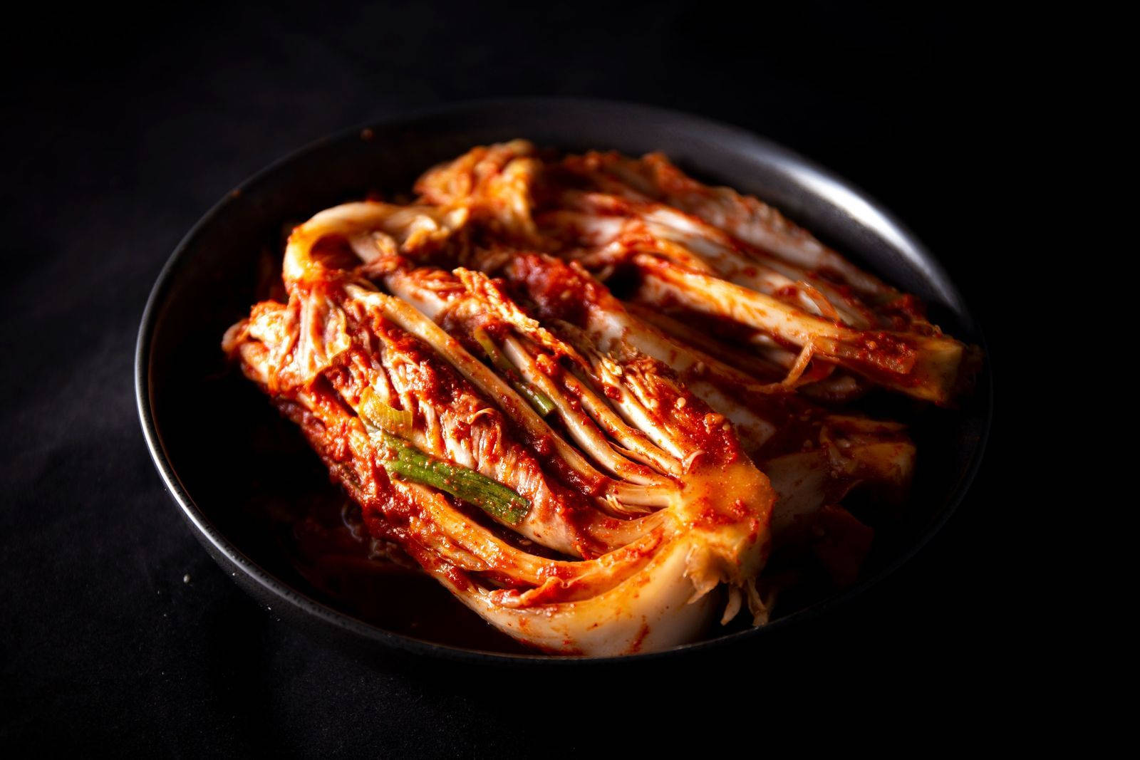 Snapshot Of Kimchi On Black Plate