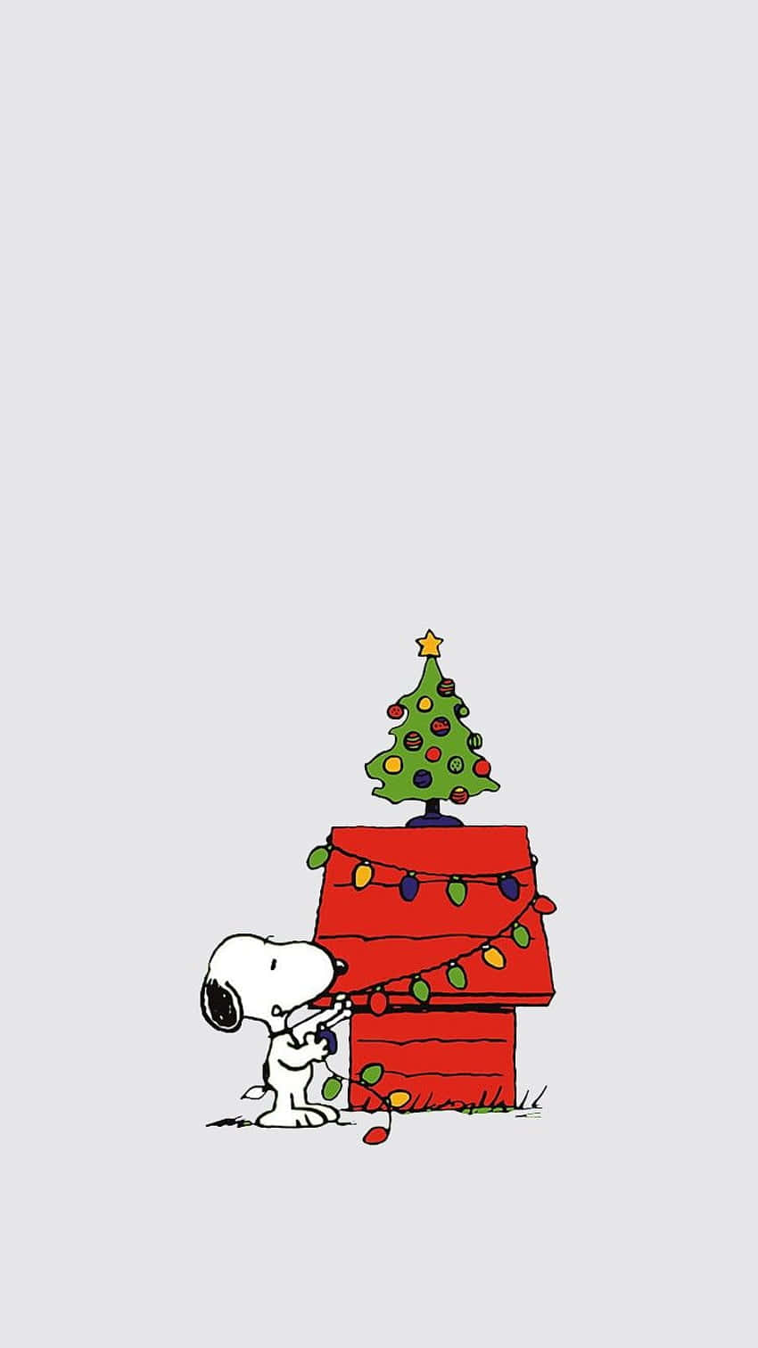 Snoopy And His Dog Are Standing Next To A Christmas Tree Background