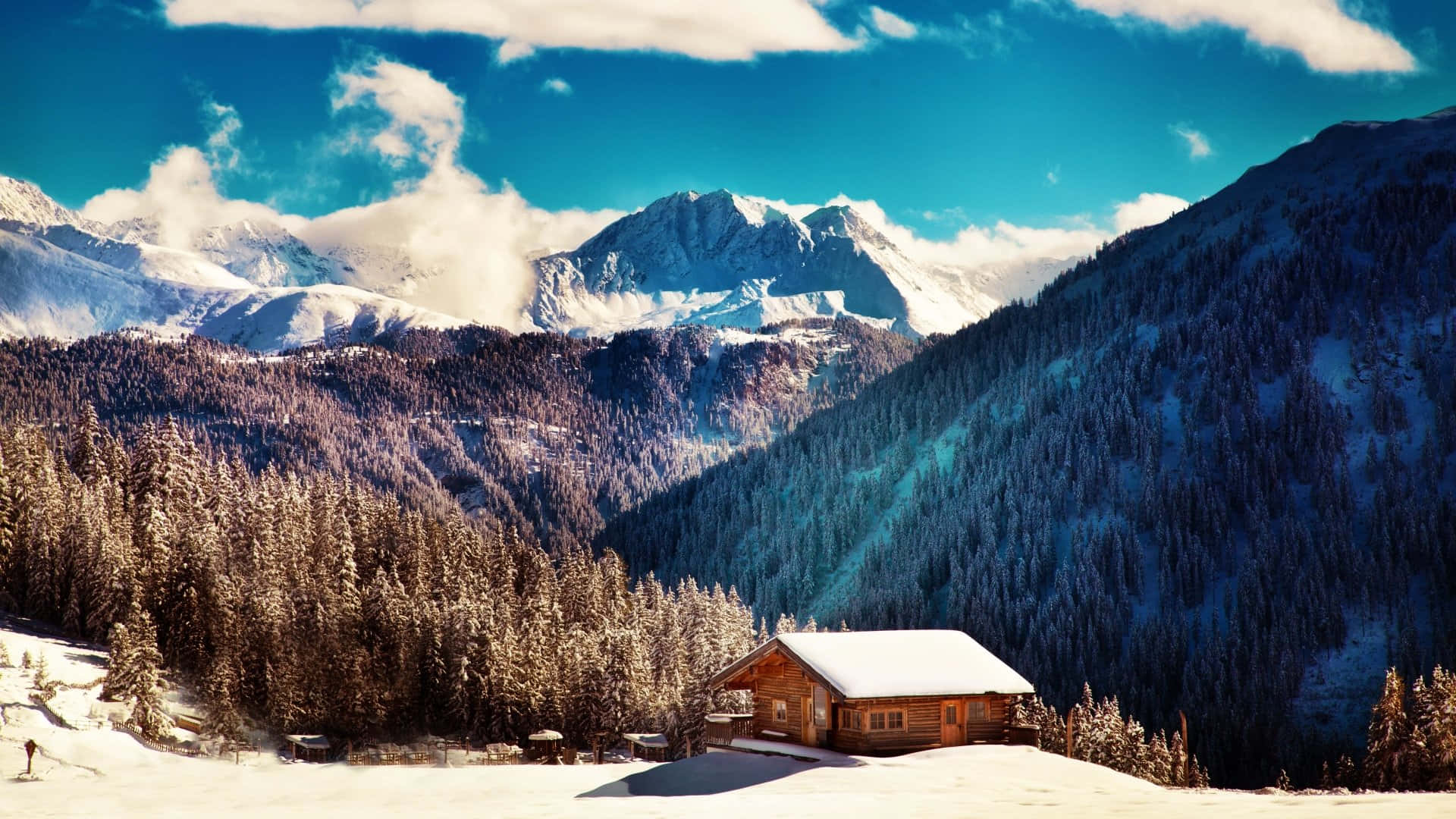 Snow Covered Cabin In The Mountain Background