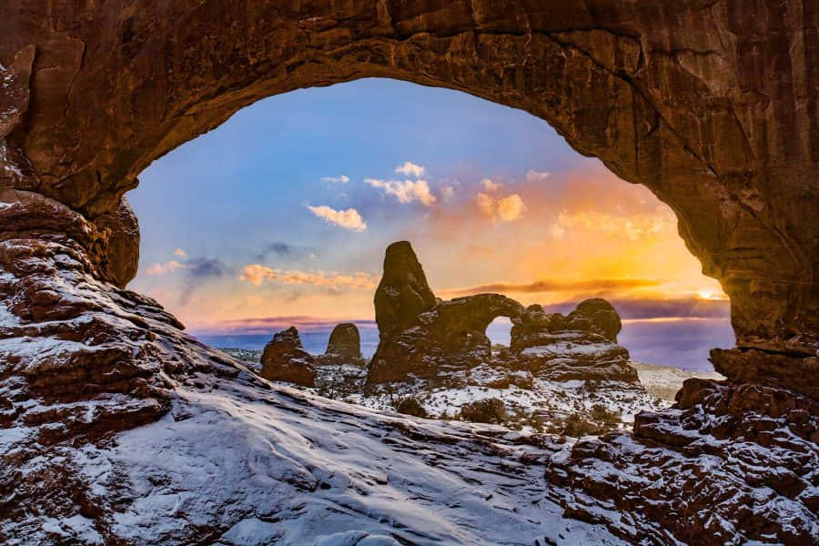 Snow-laden Delicate Arch Background