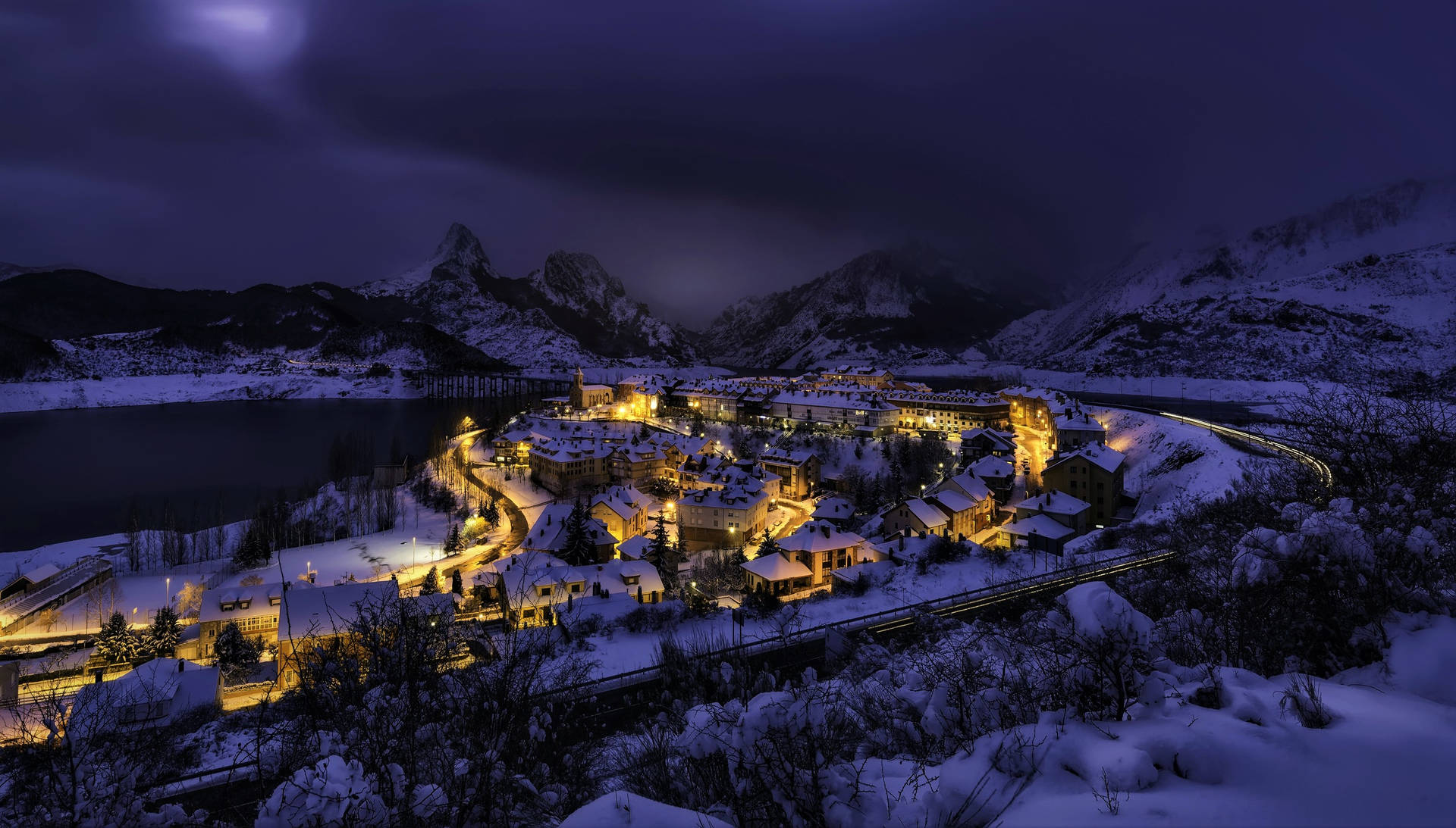Snow Mountain Town At Night Background