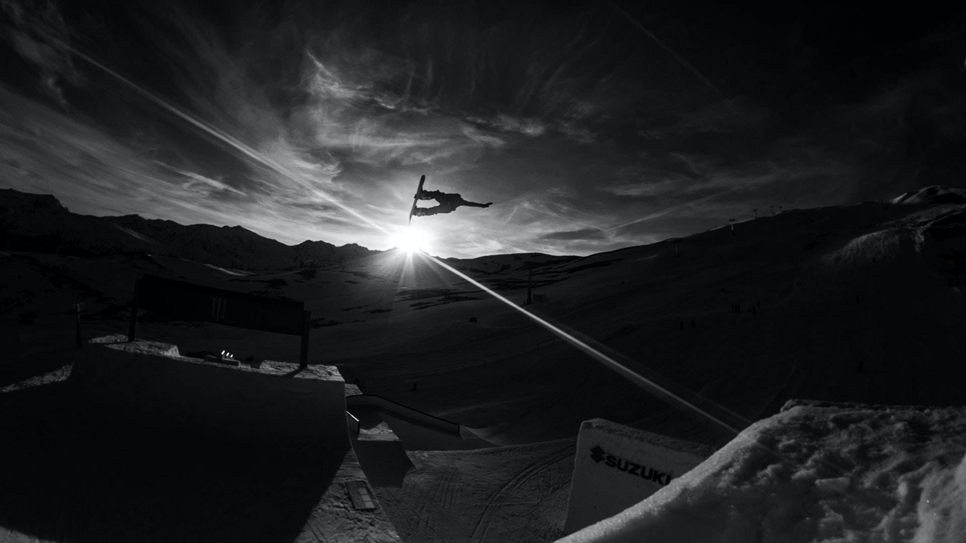 Snowboarding On Sunrise Background