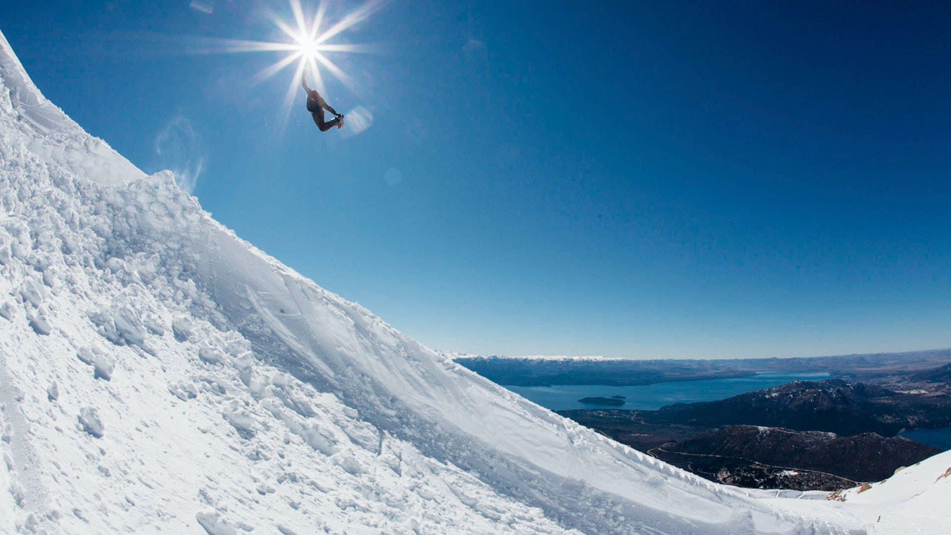 Snowboarding Under The Sun Background