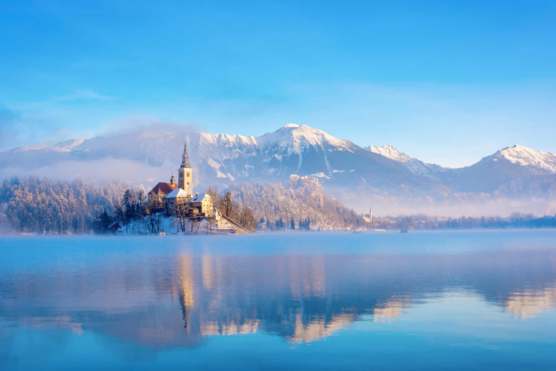 Snowed Mountain Peaks Behind Lake Bled Background