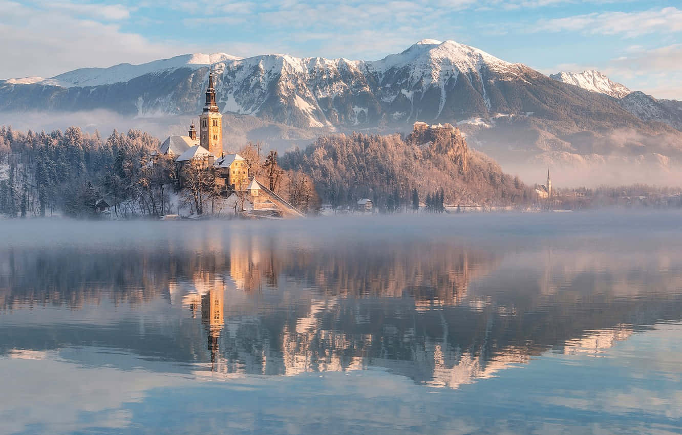 Snowed Summit At The Mountains Of Lake Bled