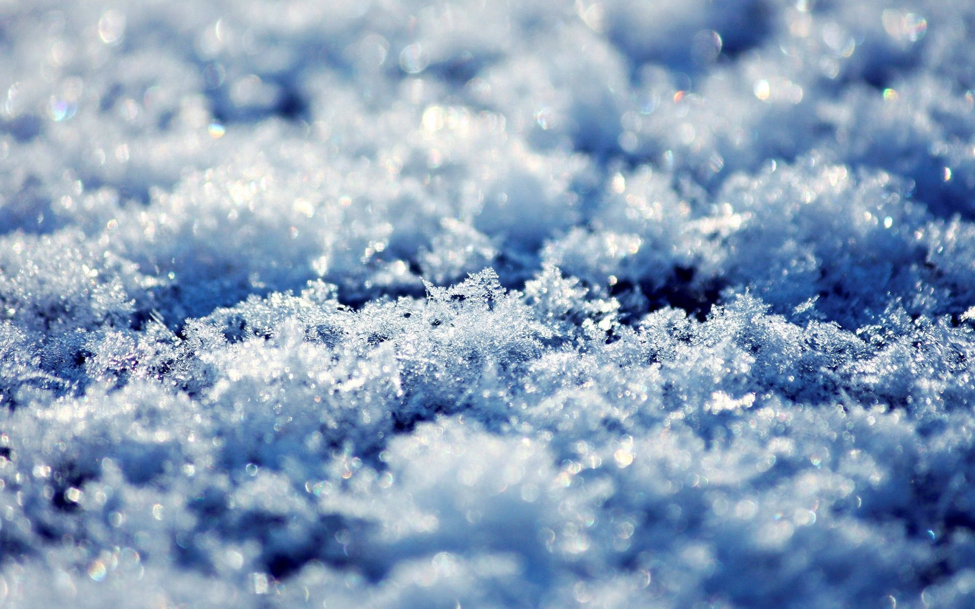 Snowflakes On The Ground With Blue Sky Background
