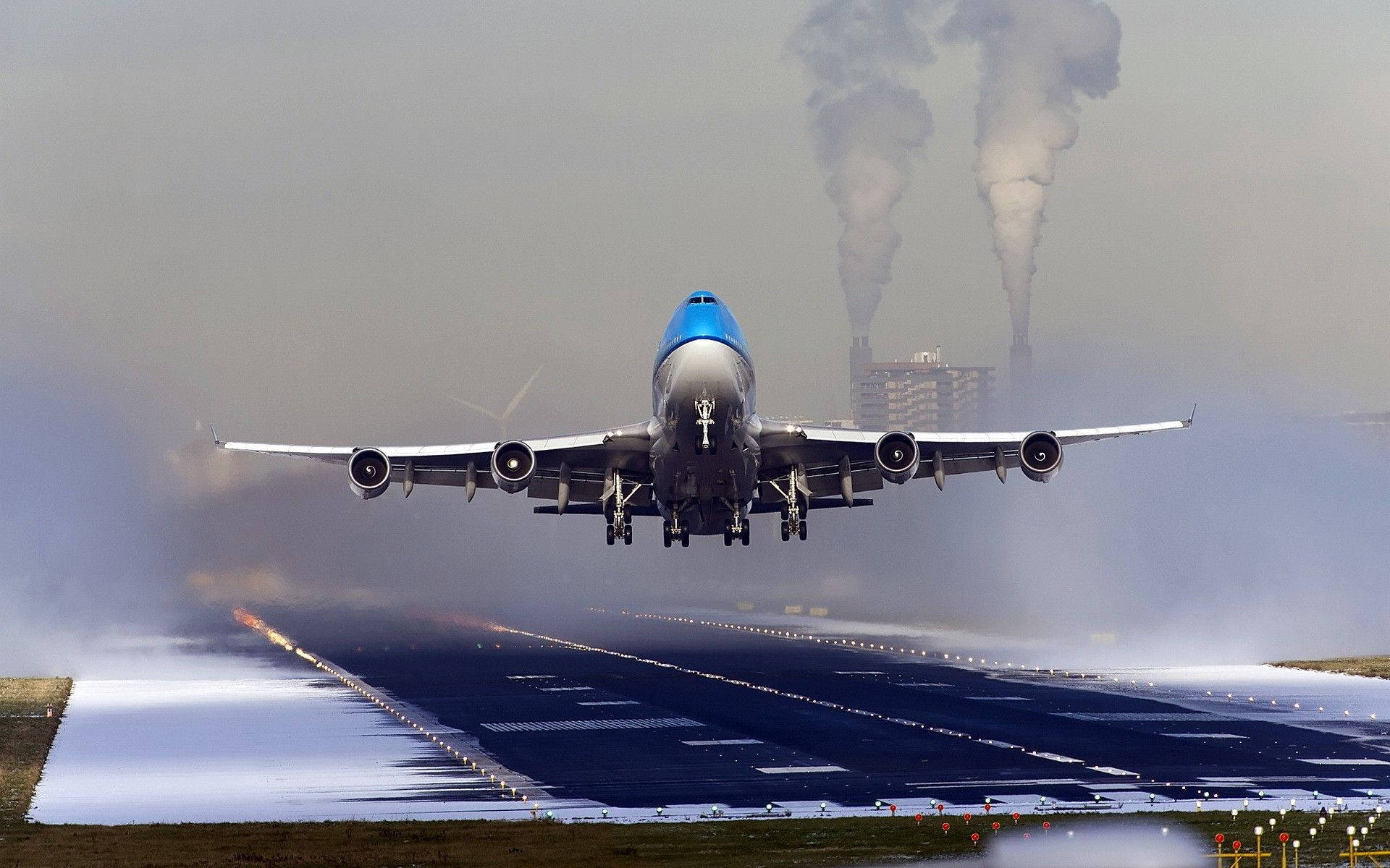 Snowy Airport Runway With Klm Aircraft Background