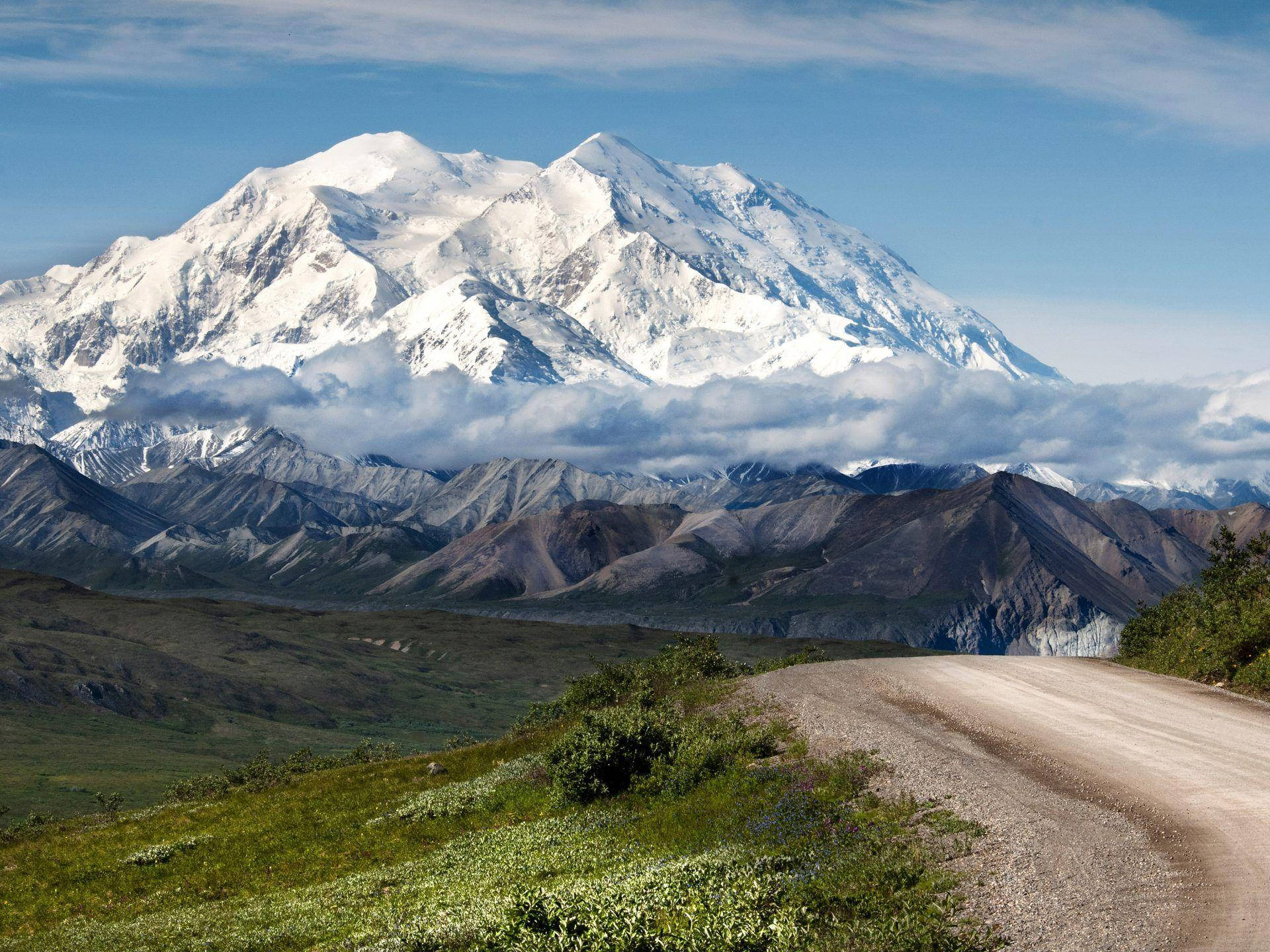 Snowy Denali With Dirt Path Background