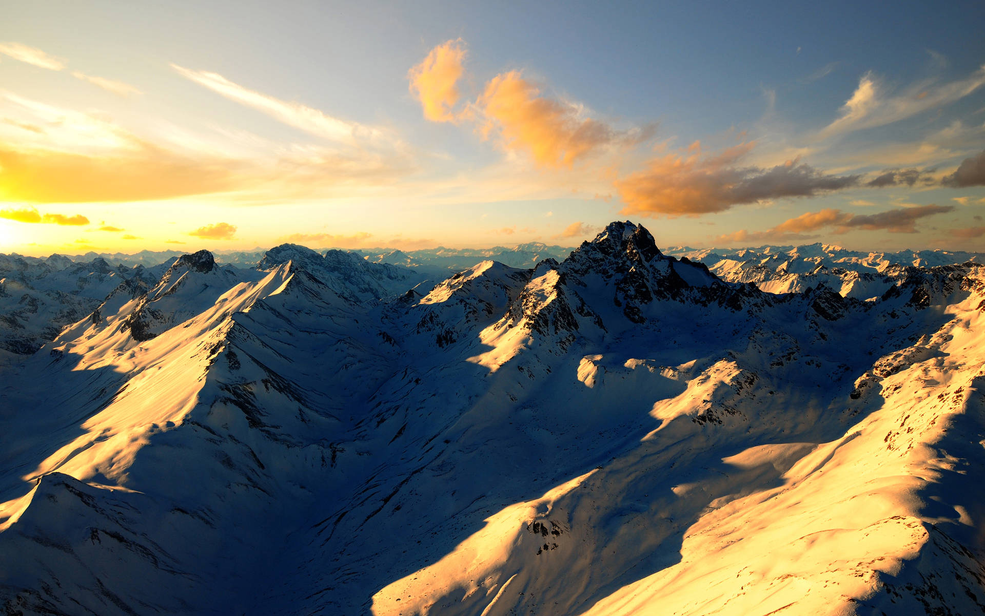 Snowy Mountain Ranges Sunset Desktop Background