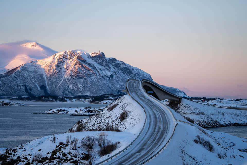 Snowy Storseisundet Bridge During Winter Background