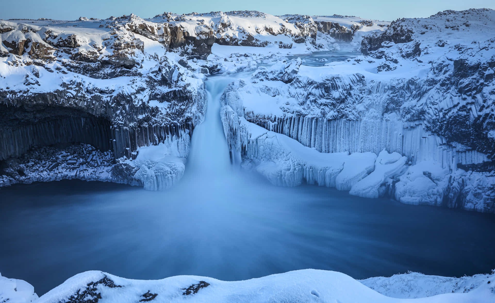 Snowy Waterfall In Iceland