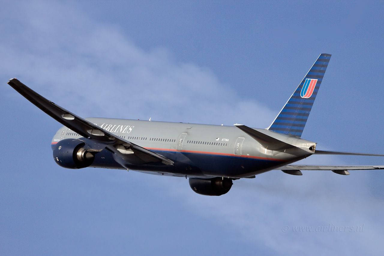 Soaring Gray United Airlines Plane Background