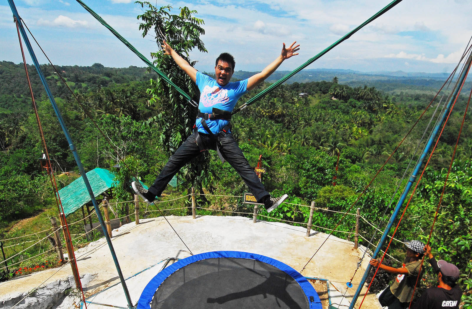 Soaring High On Bungee Trampoline Jump Background