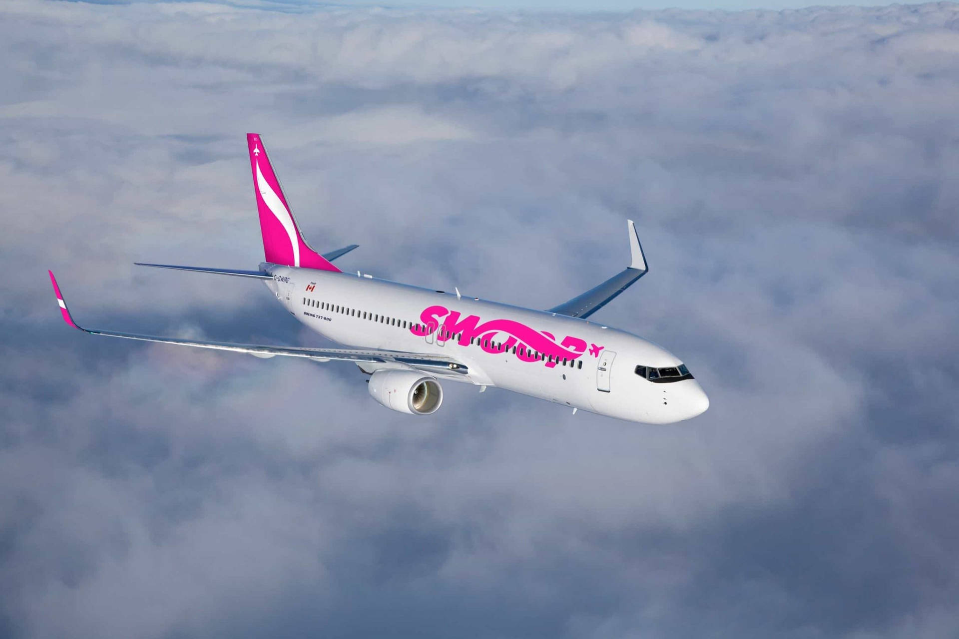 Soaring Swoop Airplane Above The Clouds Background