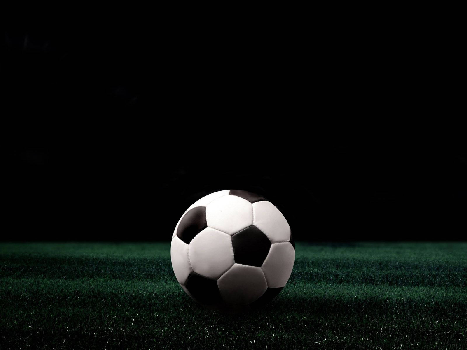 Soccer Ball In Green Field Background