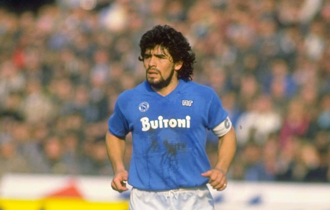 Soccer Legend Diego Maradona In Classic Uniform Background
