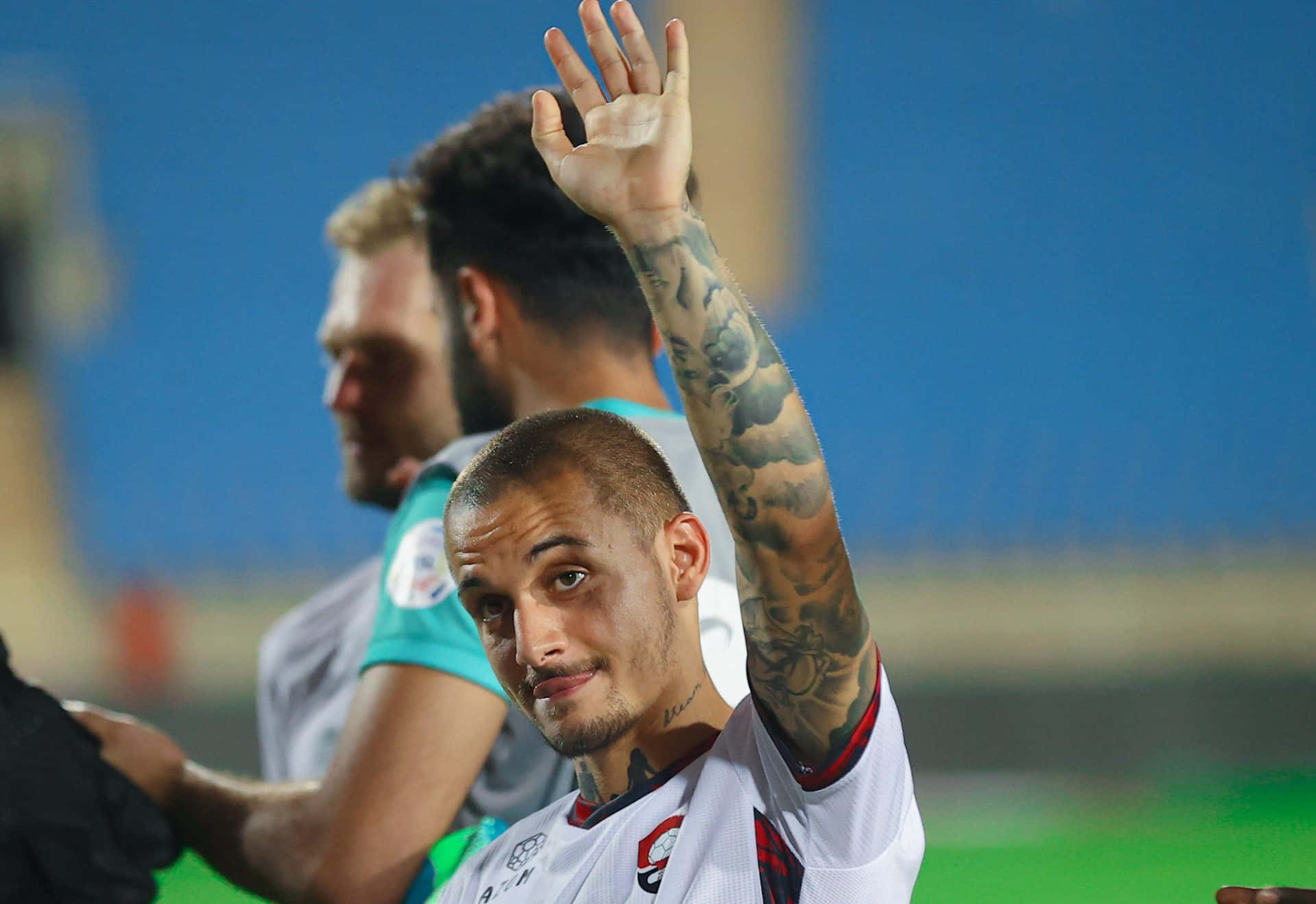 Soccer Player Acknowledging Crowd Background