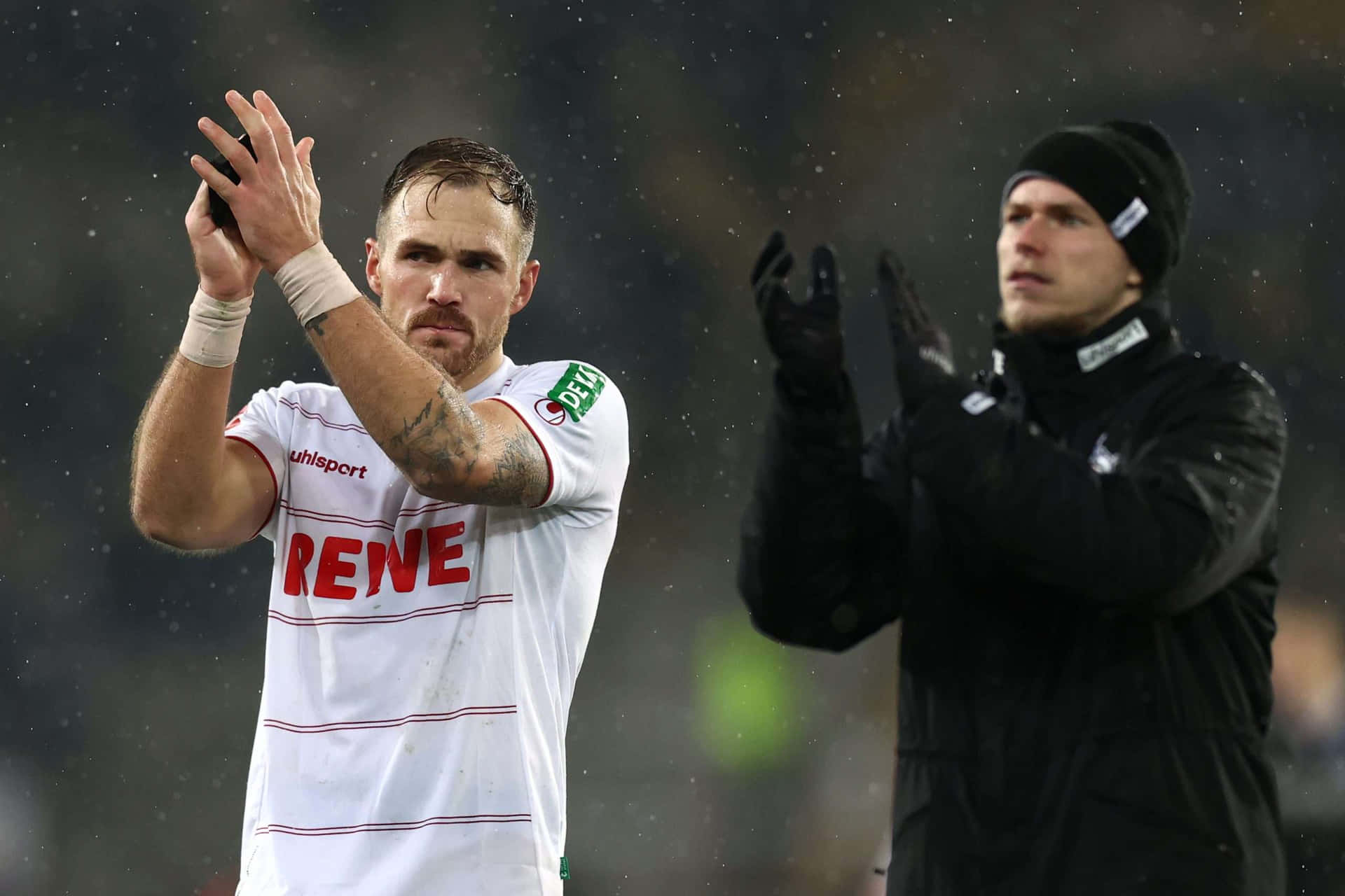 Soccer Player Applauding Fans Rainy Game Background